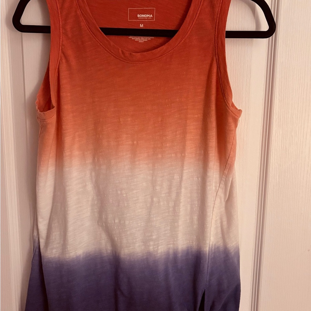 Woman’s medium sleeveless summer top.